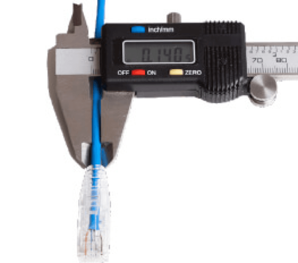 Technician measuring Performance Series patch cable with micrometer